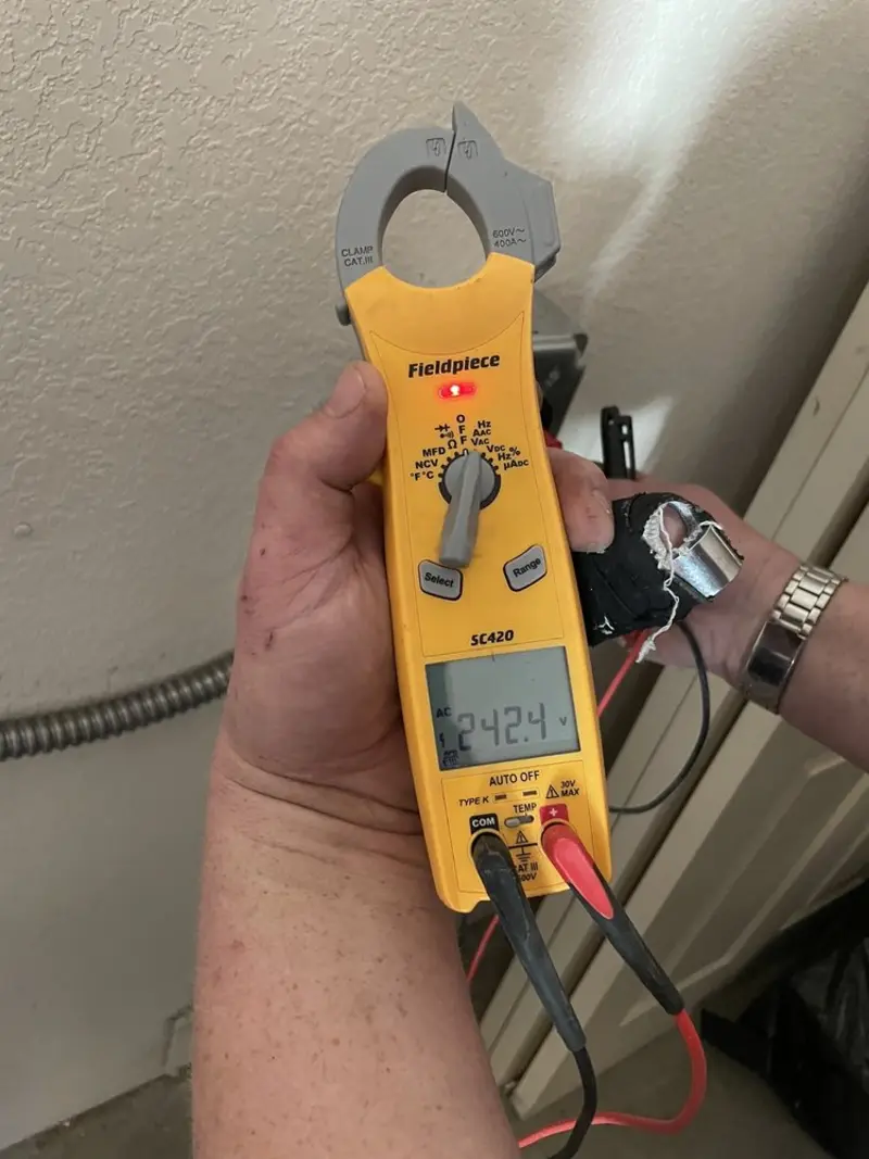 Voltage testing with clamp meter during Recessed Lighting Installation in Brodhead